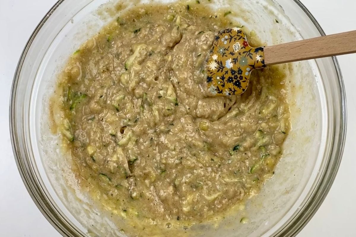 Mixed zucchini banana muffins batter in bowl.