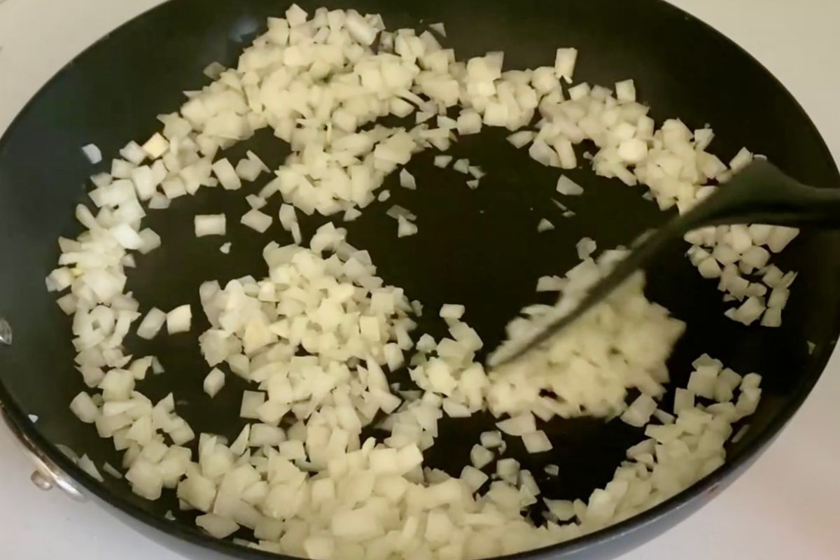 Cooked onion and garlic in a pan for chili.