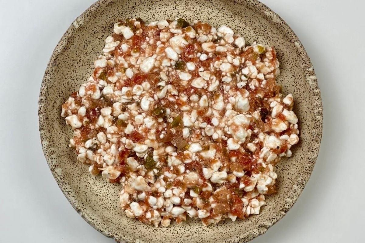 Cottage cheese and salsa mixed together in a bowl | Healthy Foodie Girl Cottage cheese and salsa mixed together in a bowl.