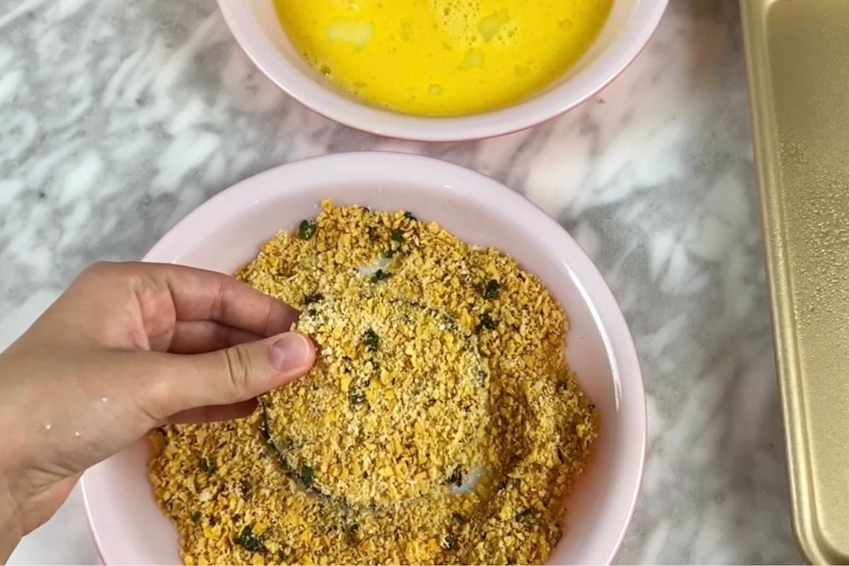 Eggplant slice dredged in cornflake mixture.