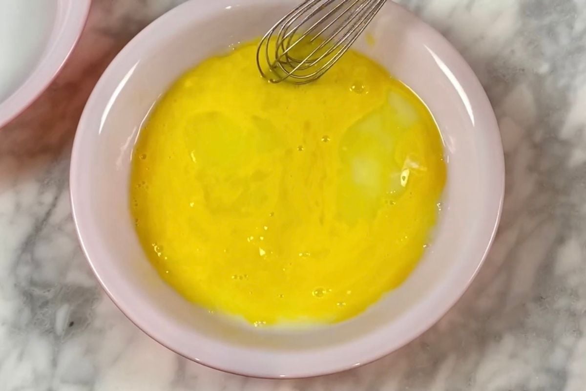 Whisked egg for eggplant parmesan.