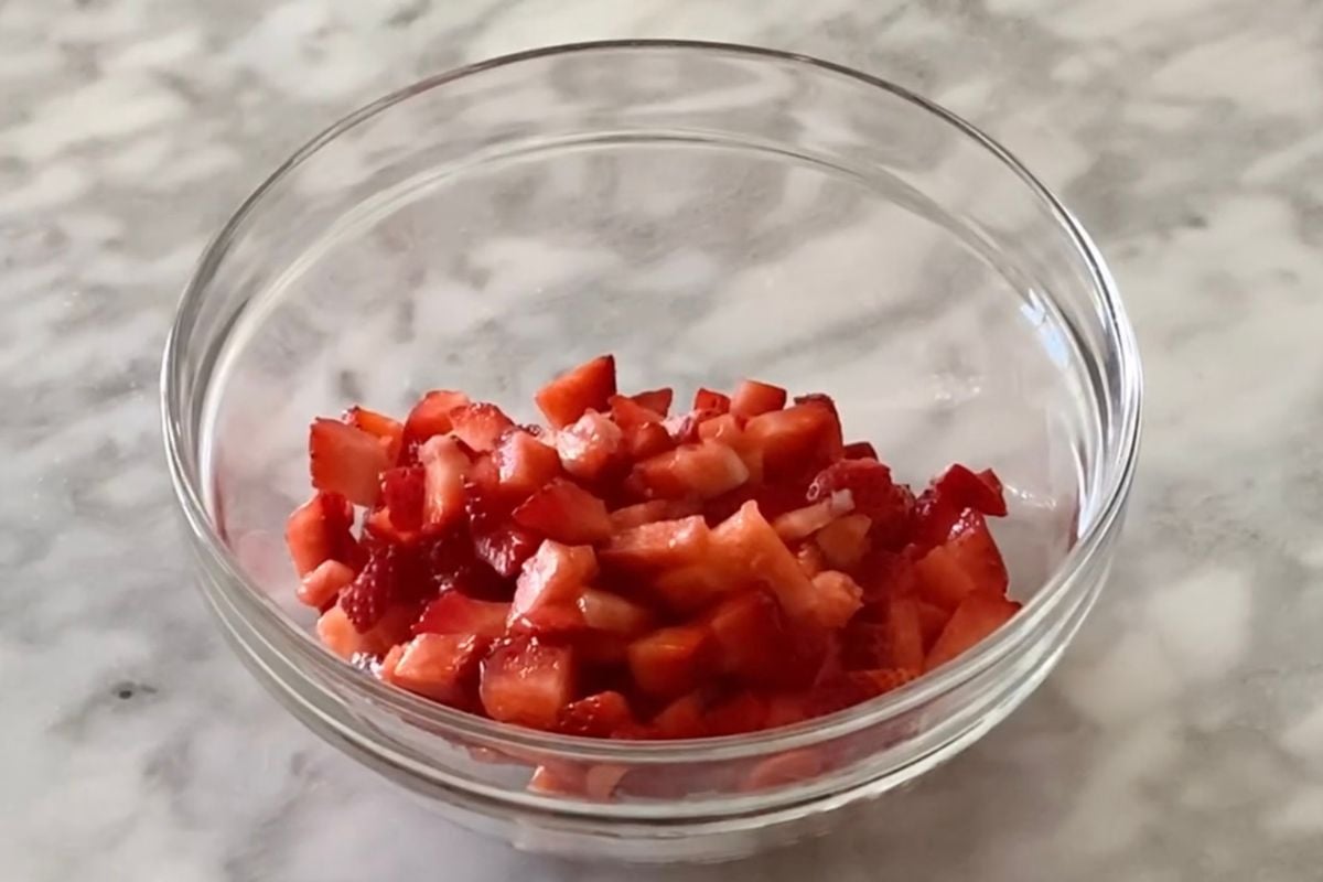 Chopped strawberries in a bowl for muffins.