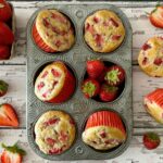 Strawberry Banana Muffins in a muffin pan.