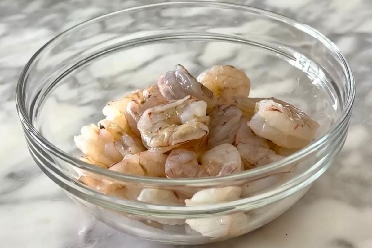 Peeled raw shrimp in a bowl | Healthy Foodie Girl Peeled raw shrimp in a bowl.