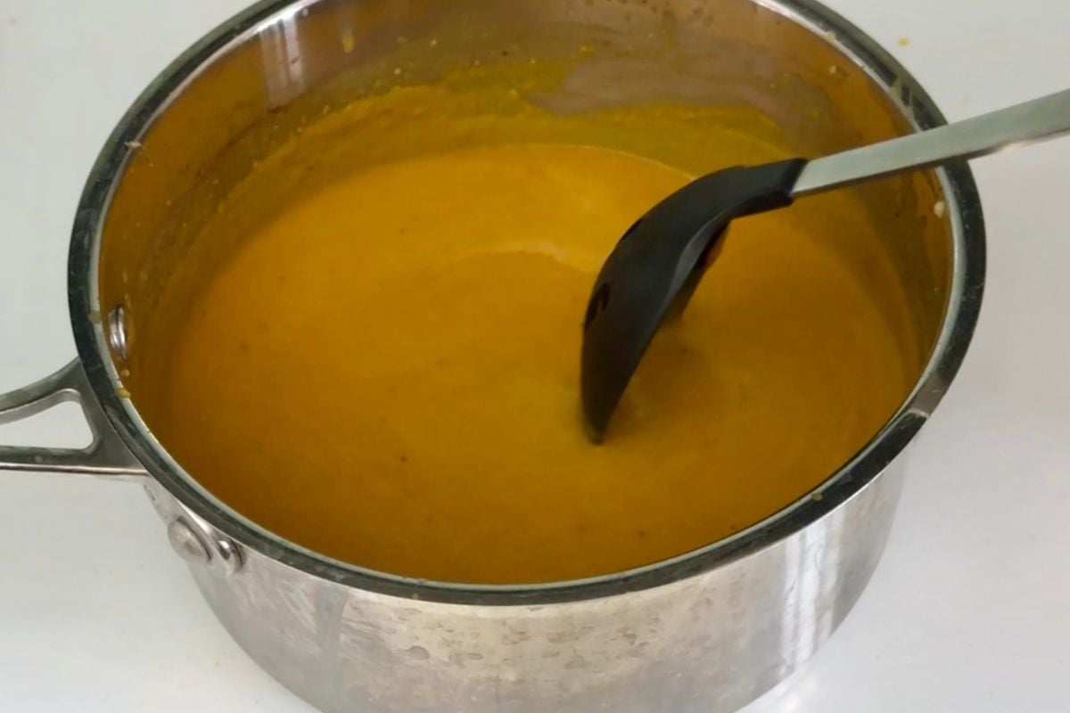 Mixed pumpkin soup in a saucepan.