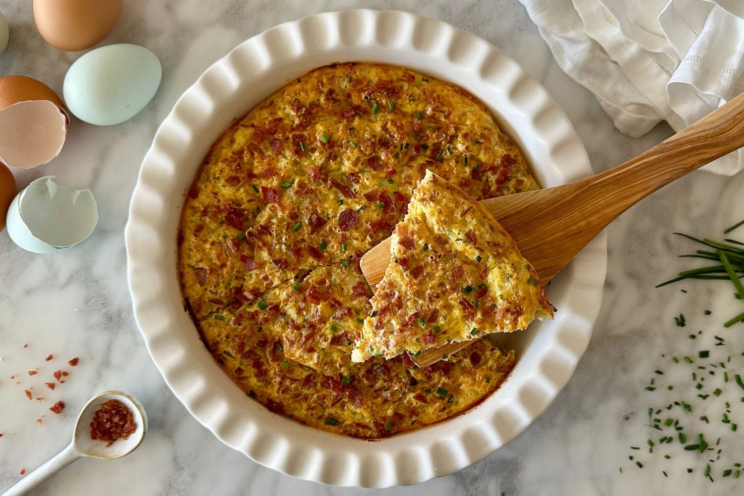 Crustless Bacon and Cheese Quiche | Healthy Foodie Girl Crustless Bacon and Cheese Quiche in a quiche pan.