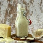 Healthy Homemade Creamy Italian Dressing with Greek yogurt in a jar.