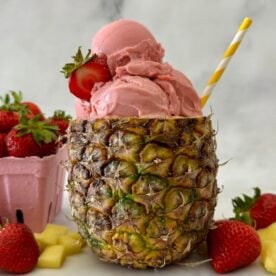 Strawberry Dole Whip | Healthy Foodie Girl Strawberry Dole Whip served in a pineapple.