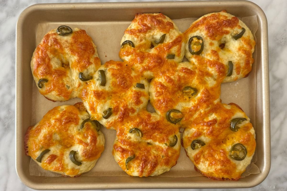 Baked cottage cheese jalapeño cheddar bagels on baking sheet | Healthy Foodie Girl Baked cottage cheese jalapeño cheddar bagels on baking sheet