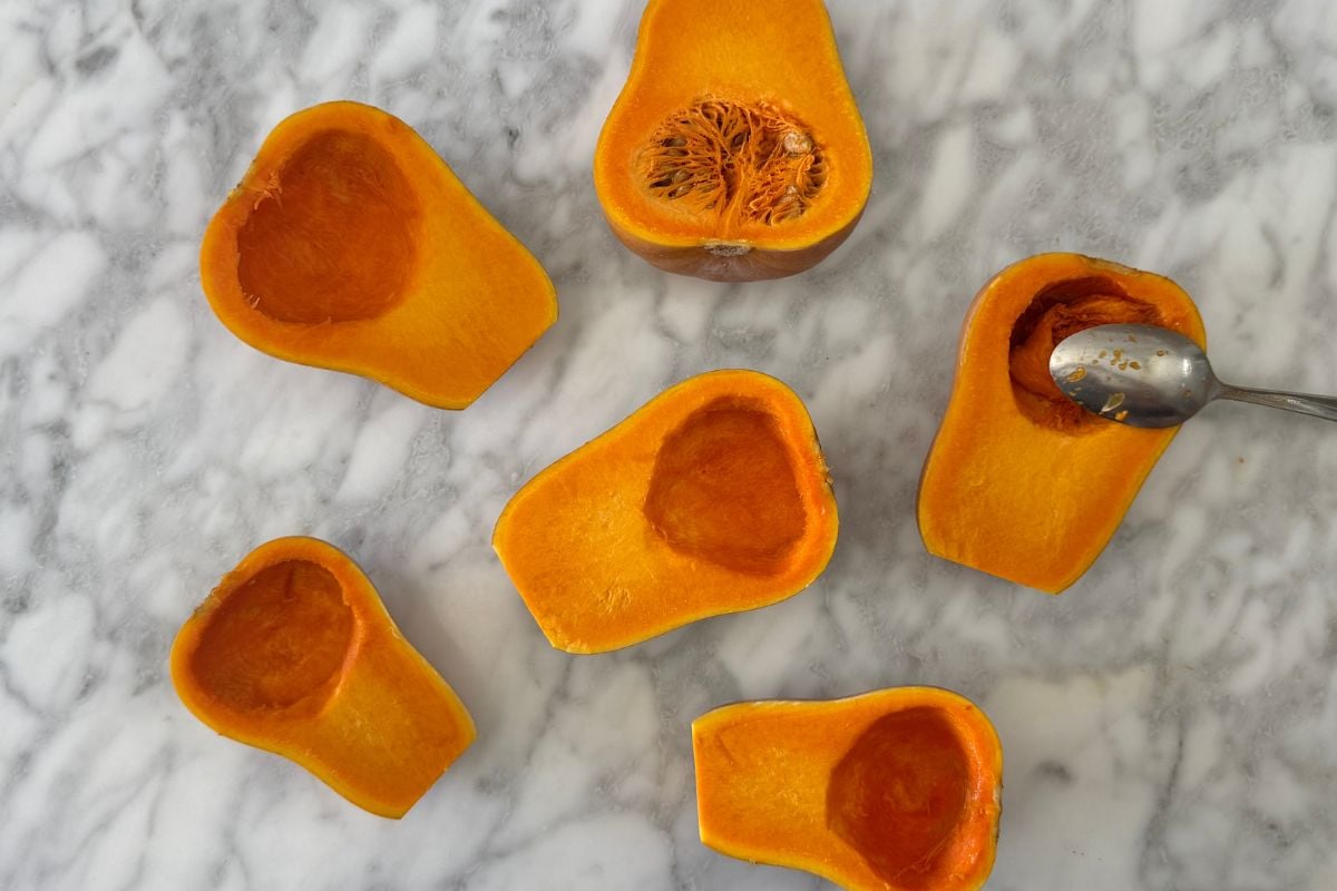 Honeynut squash cut in half with seeds removed | Healthy Foodie Girl Honeynut squash cut in half with seeds removed