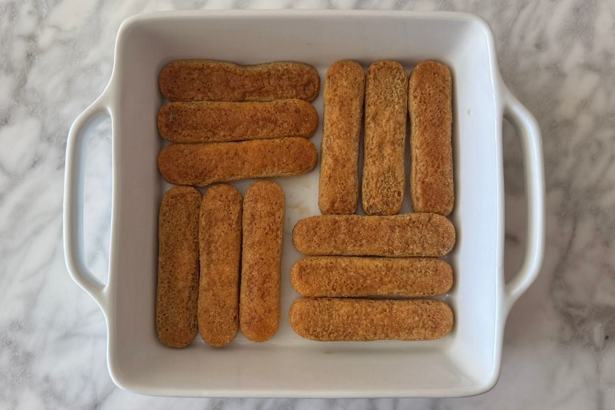 Coffee soaked ladyfingers in baking dish