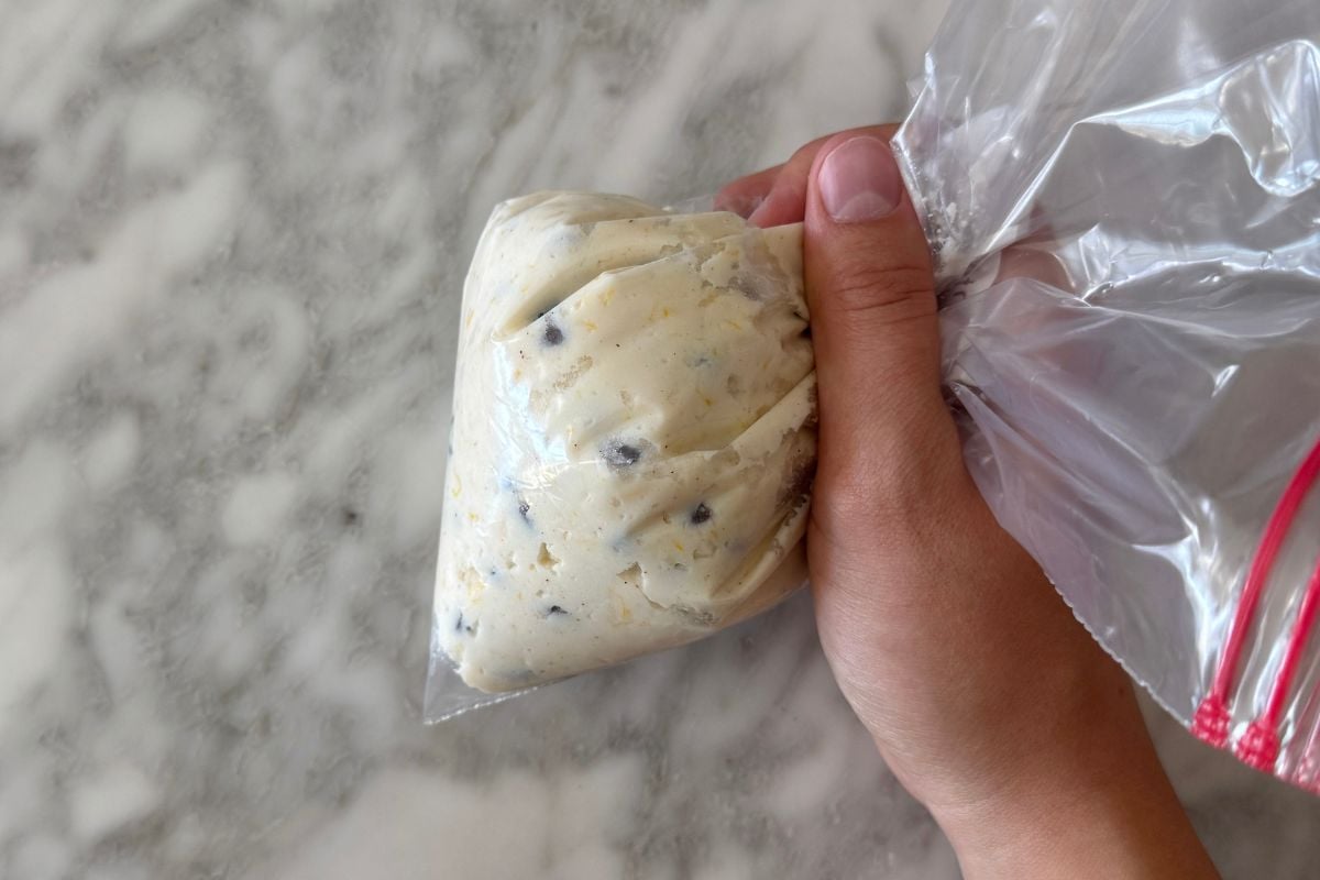 Cannoli bites filling in a piping bag