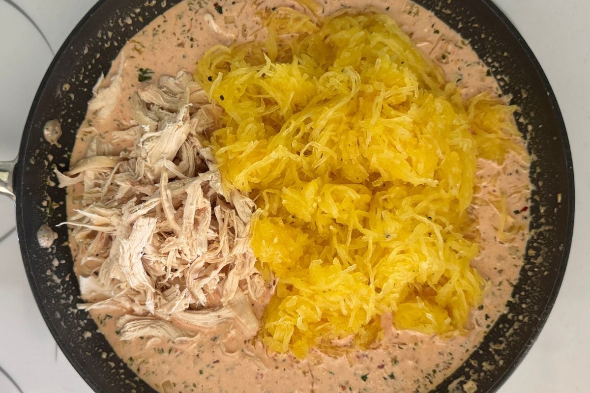 Chicken and spaghetti squash strands in skillet