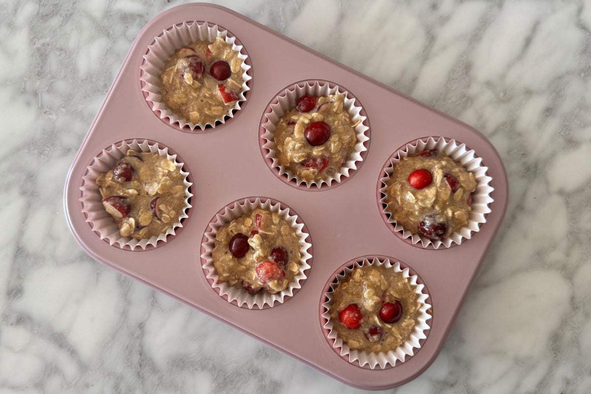 Cranberry banana oat muffins in a muffin pan