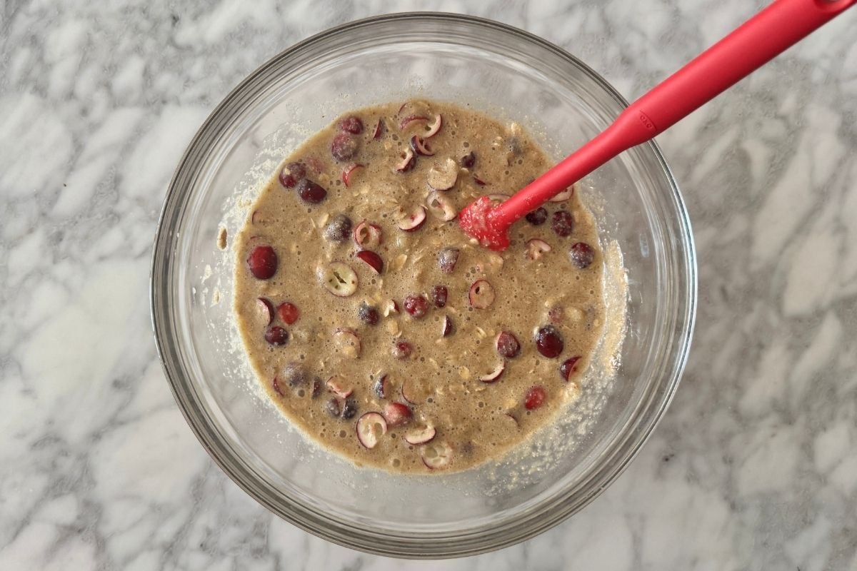 Fresh cranberries folded into the cranberry banana oat muffins batter