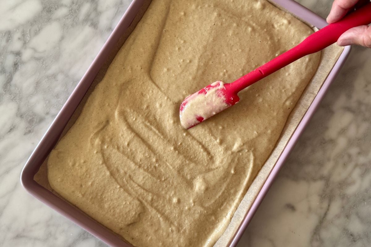 Pancake batter spread on a sheet pan