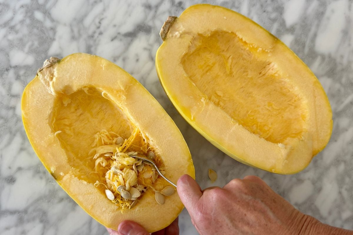 Seeds scooped out of spaghetti squash | Healthy Foodie Girl Seeds scooped out of spaghetti squash