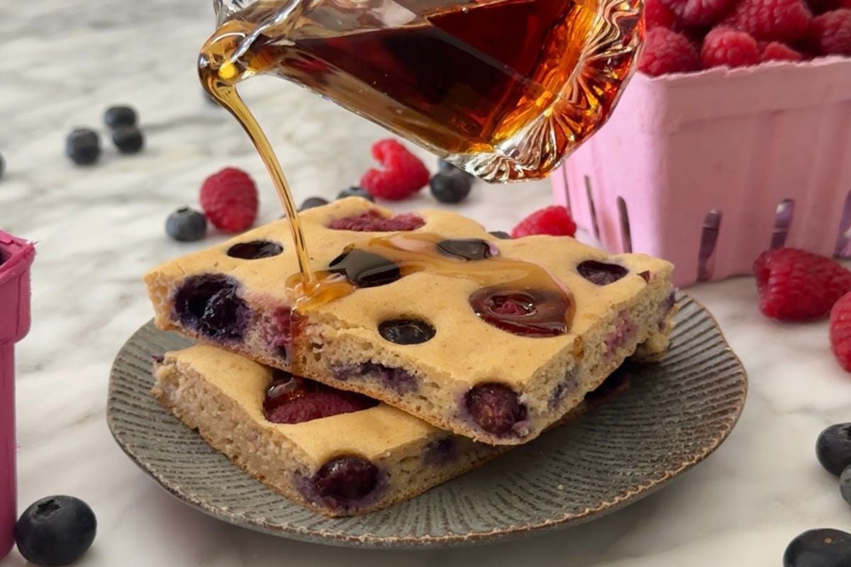 Sheet pan protein pancakes drizzled with maple syrup