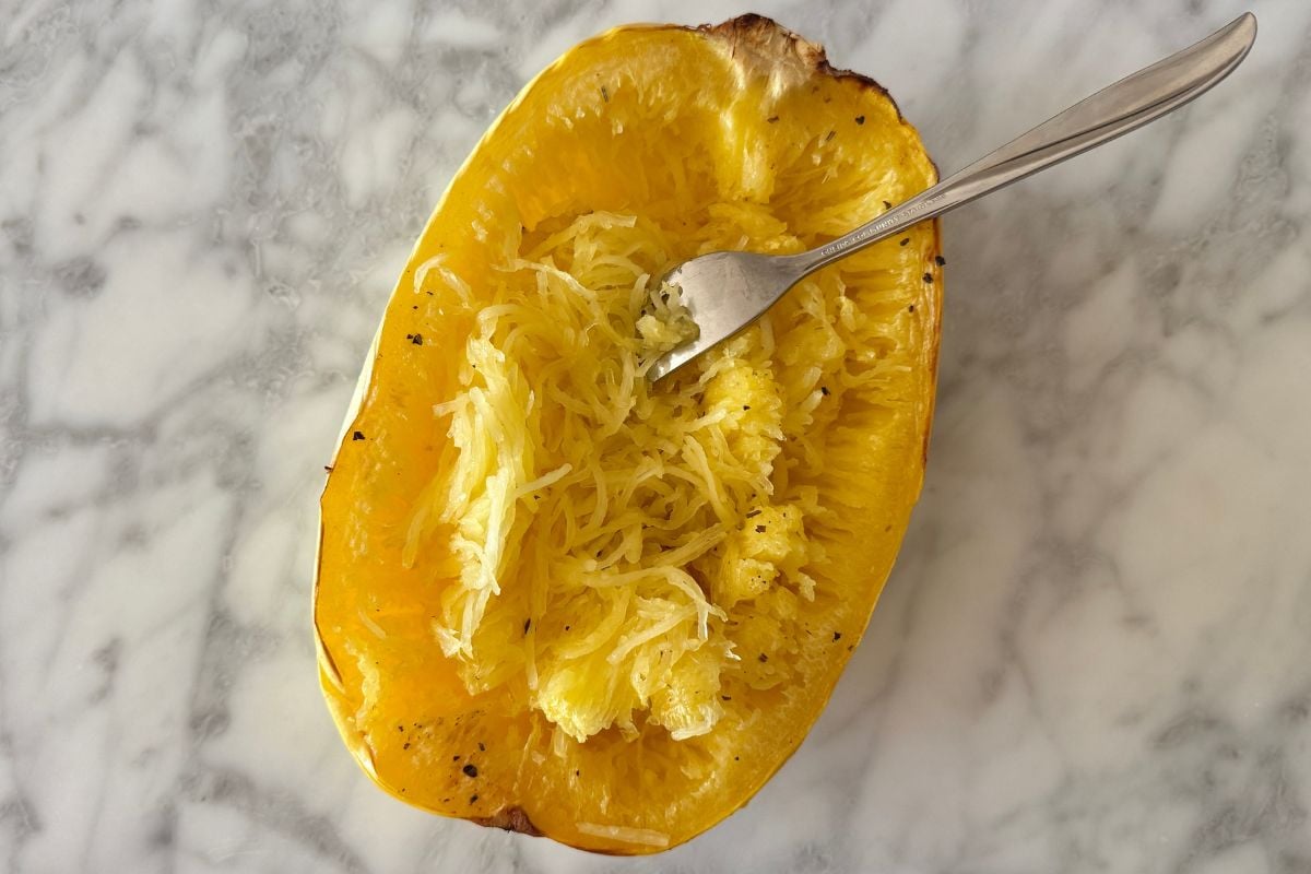 Spaghetti squash strands | Healthy Foodie Girl Spaghetti squash strands with a fork.