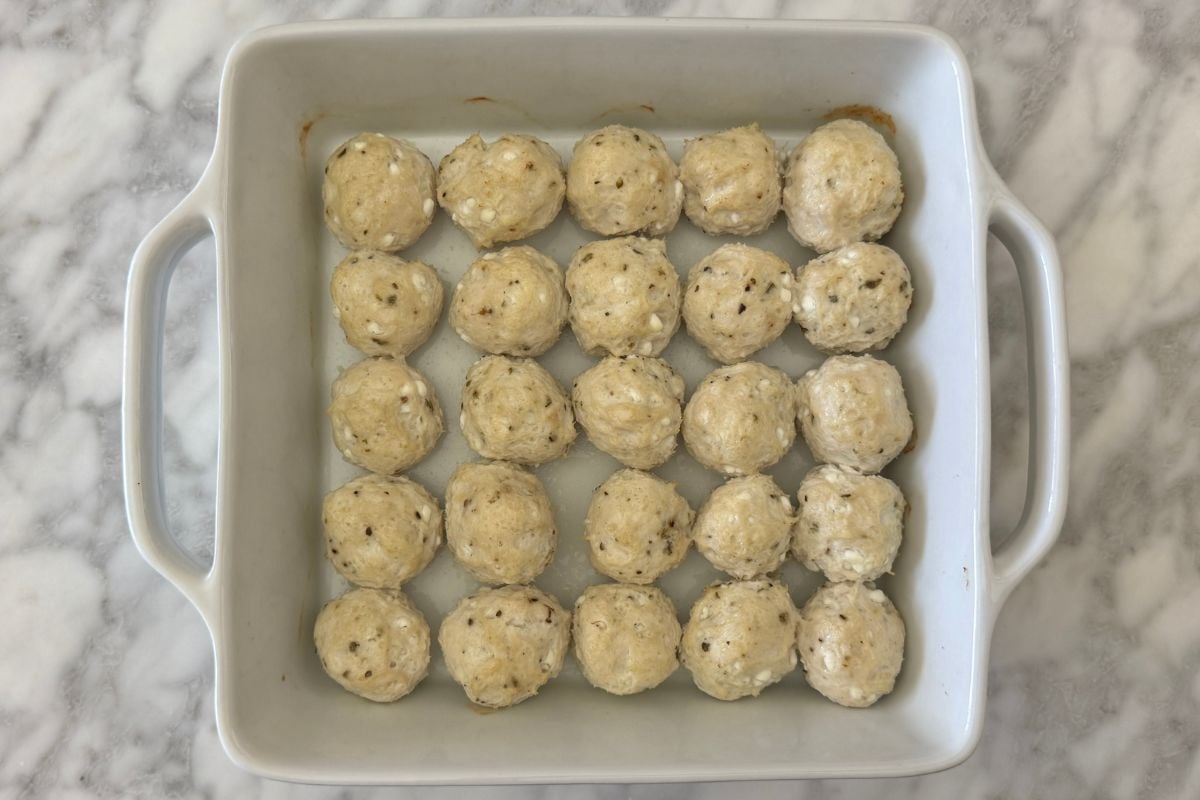 Baked turkey cottage cheese meatballs in a baking dish.