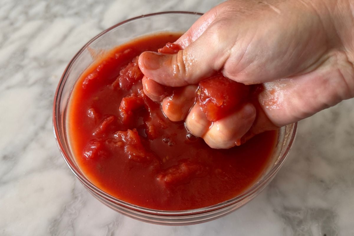 Crushed peeled San Marzano tomatoes in bowl