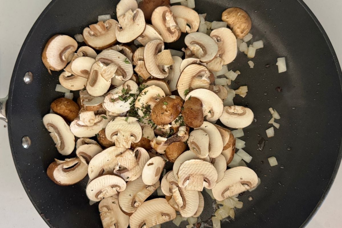 Sliced mushrooms in a skillet