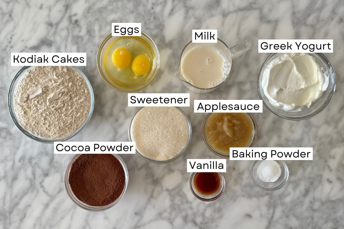 Ingredients for chocolate Kodiak protein muffins in bowls | Healthy Foodie Girl Ingredients for chocolate Kodiak protein muffins in bowls.