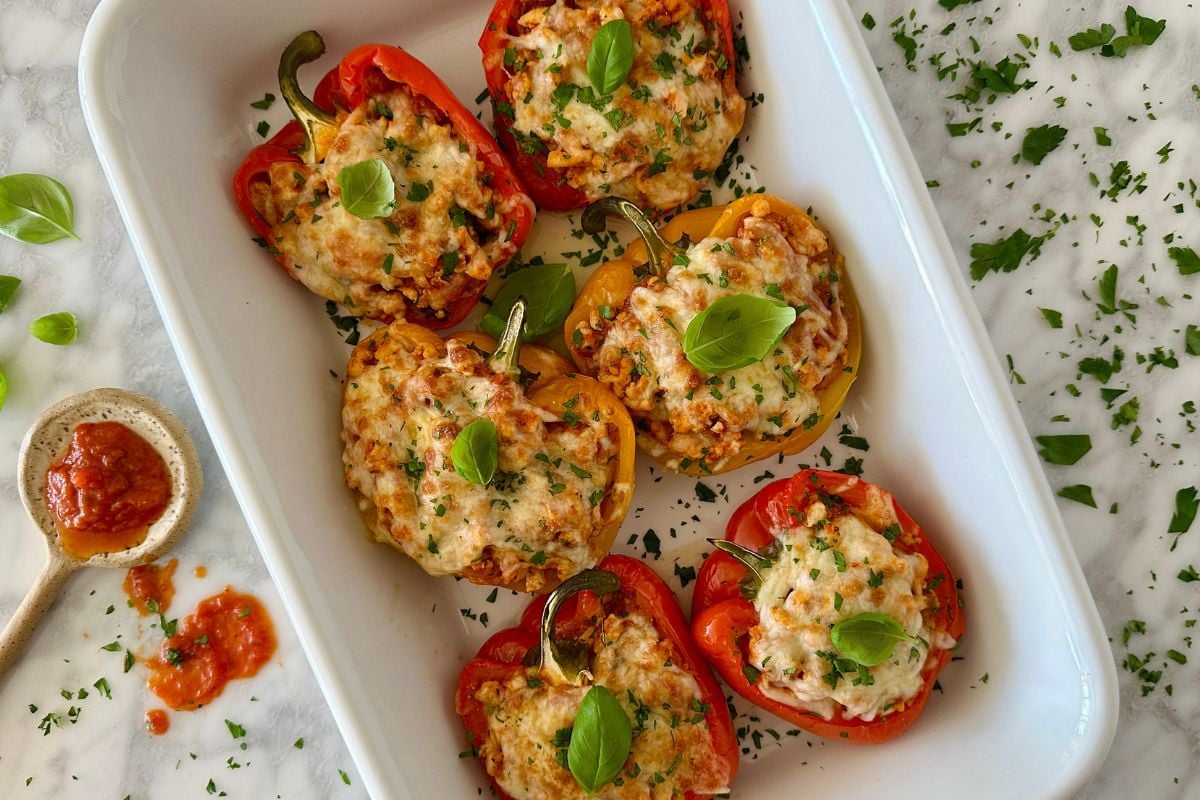 Italian ground turkey stuffed peppers cooked in a baking dish | Healthy Foodie Girl Italian ground turkey stuffed peppers cooked in a baking dish.