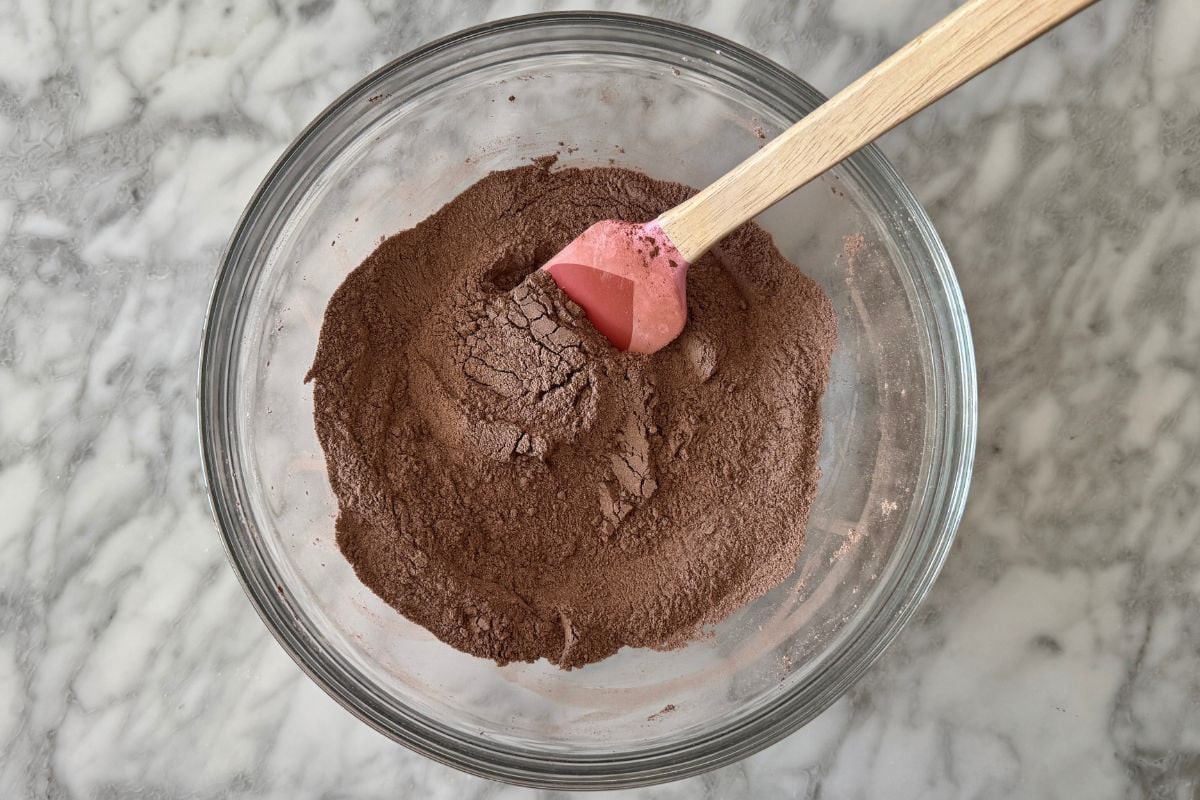 Mixed dry ingredients for chocolate Kodiak muffins in bowl | Healthy Foodie Girl Mixed dry ingredients for chocolate Kodiak muffins in a bowl.
