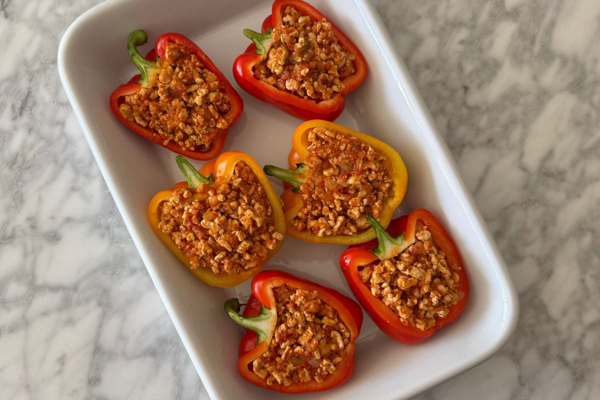 Sliced bell peppers stuffed with cooked ground turkey mixture | Healthy Foodie Girl Sliced bell peppers stuffed with cooked ground turkey mixture.