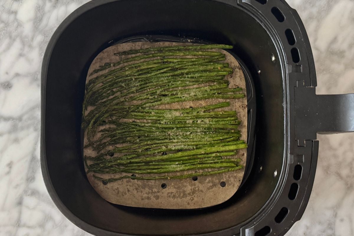 Air fryer asparagus with Parmesan in the air fryer.