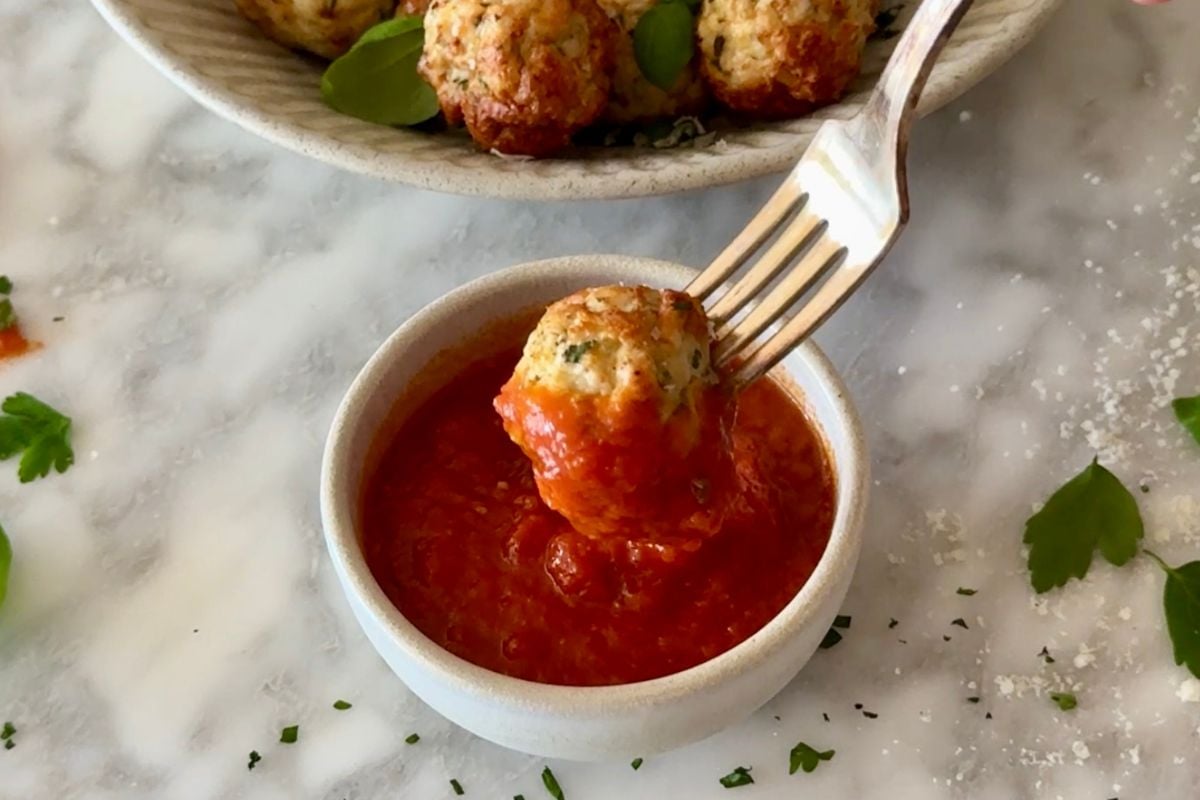 Turkey meatball dipped in marinara sauce.