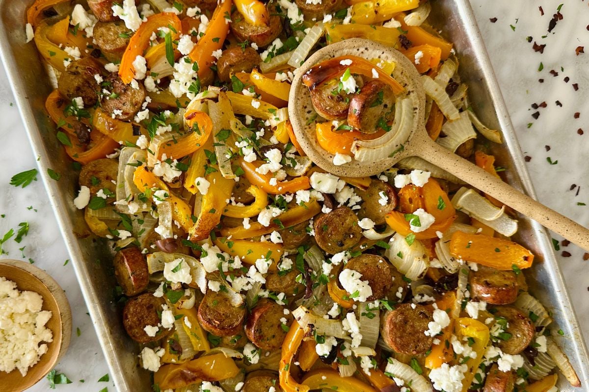 Baked sausage and peppers on sheet pan.