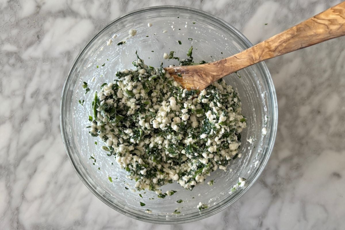 Cottage cheese and spinach mixture in bowl.