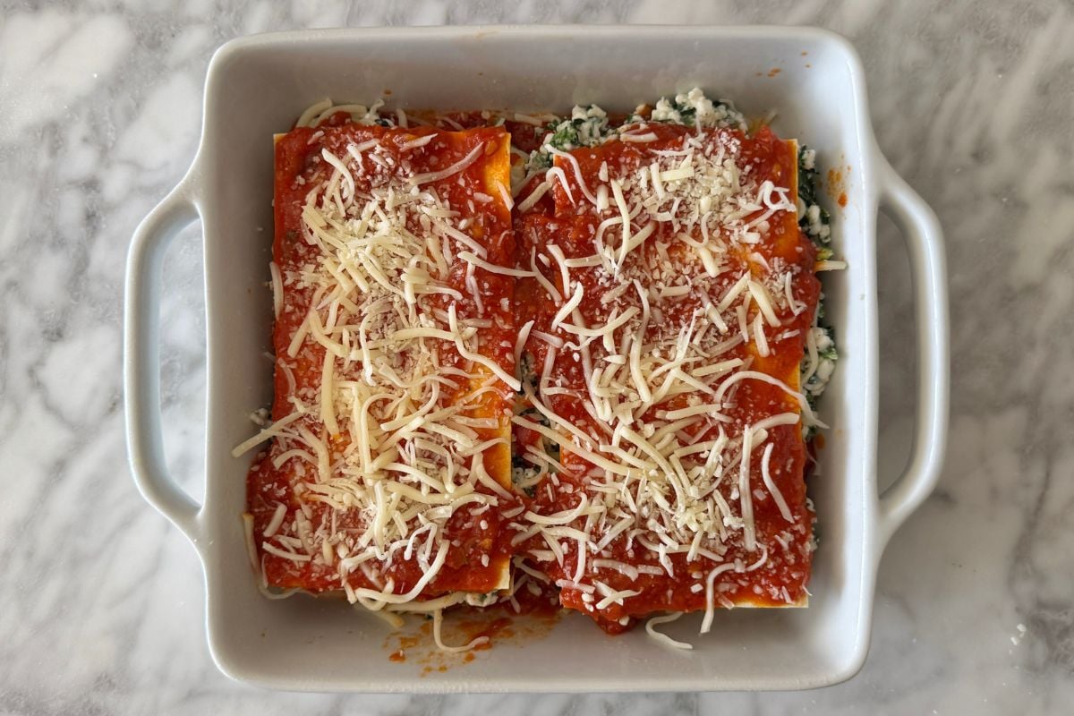 Lasagna topped with mozzarella cheese.