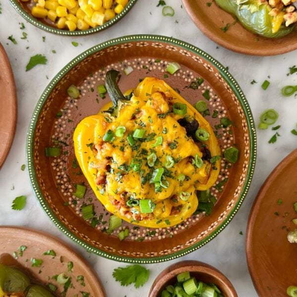 Mexican Stuffed Peppers with Ground Turkey in a dish topped with cilantro.