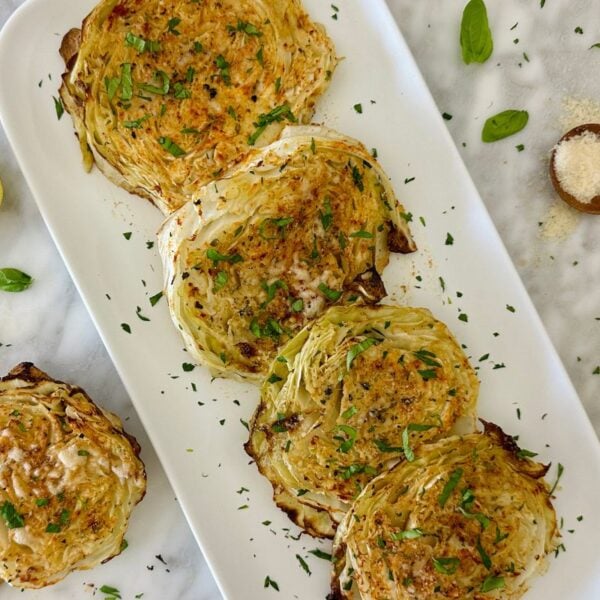 Roasted Cabbage Steaks with Parmesan Recipe on a serving platter | Healthy Foodie Girl Roasted Cabbage Steaks with Parmesan Recipe on a serving platter.