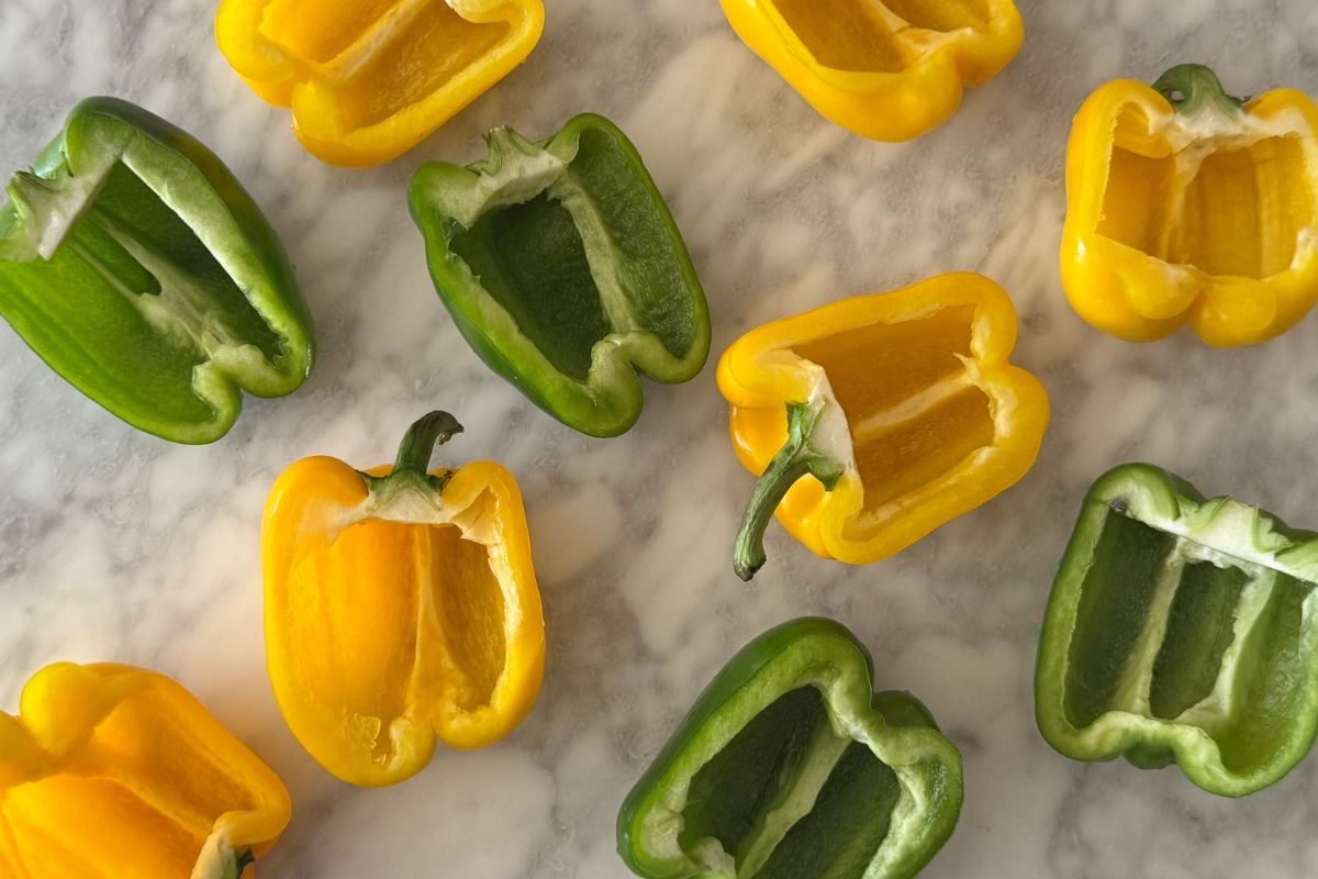 Sliced bell peppers with seeds removed.