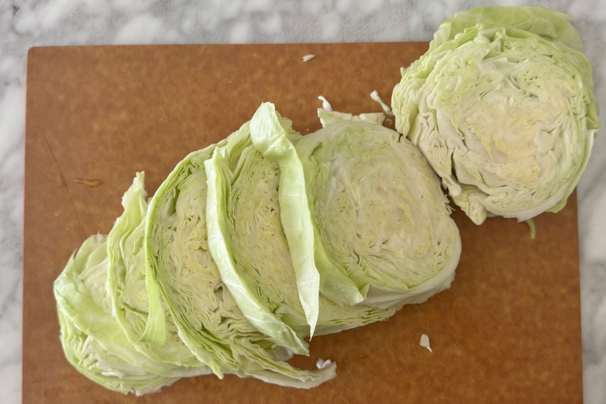 Sliced cabbage on a cutting board.