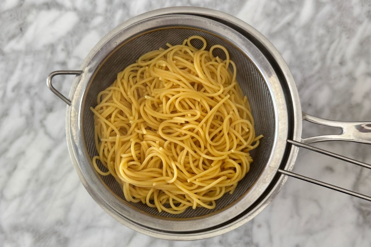 Cooked high fiber high protein noodles in a strainer.