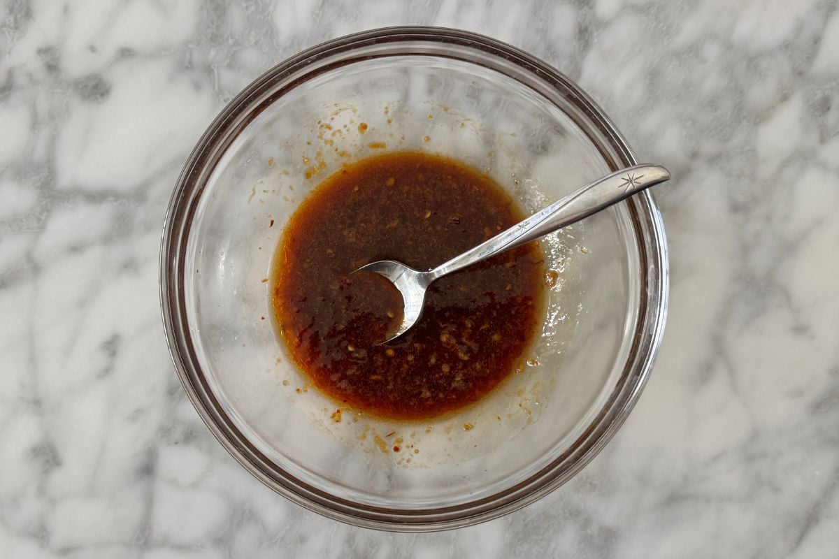 Ingredients for PB2 spicy peanut sauce in a bowl.