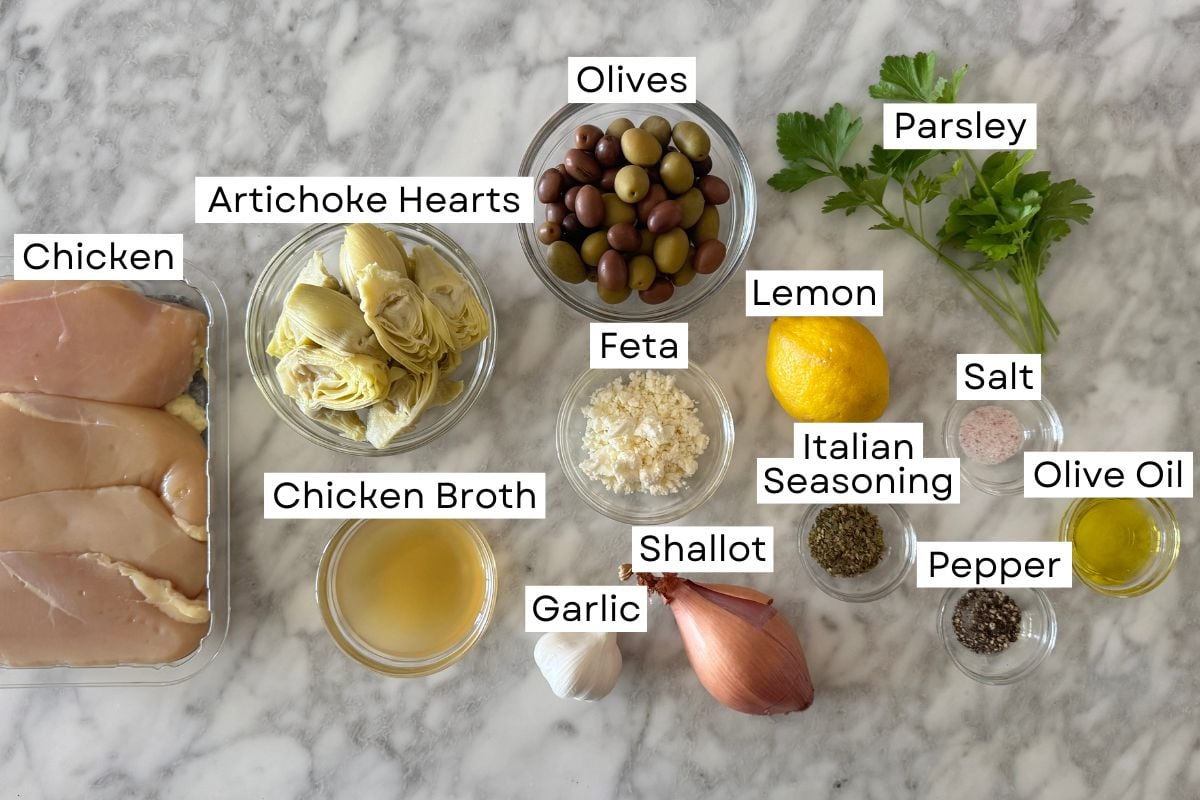 Ingredients for chicken with artichokes and olives in bowls.