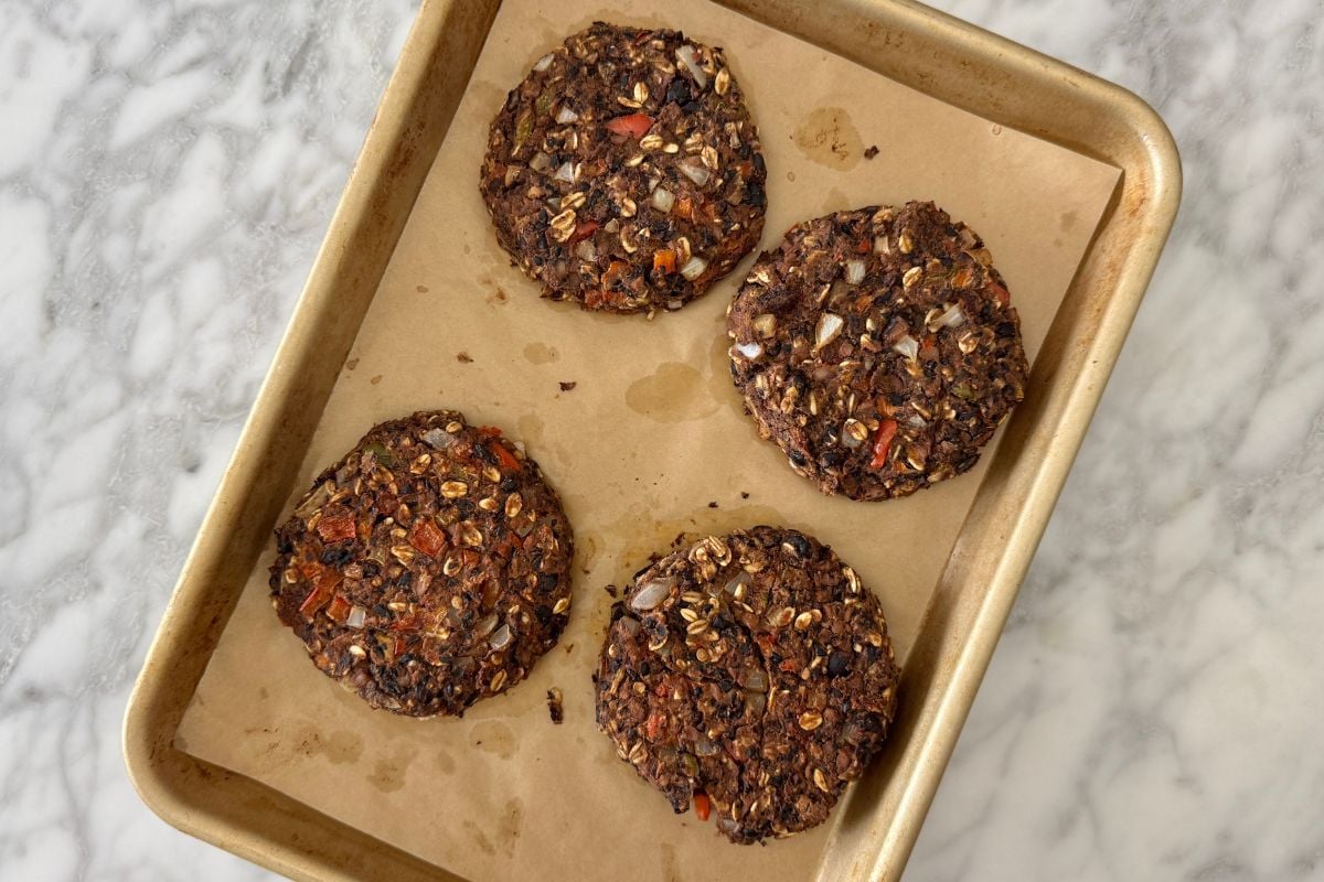Baked chipotle black bean burgers on a sheet pan.