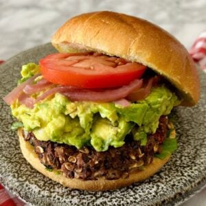 Chipotle Black Bean Burgers with Oats served on a plate.