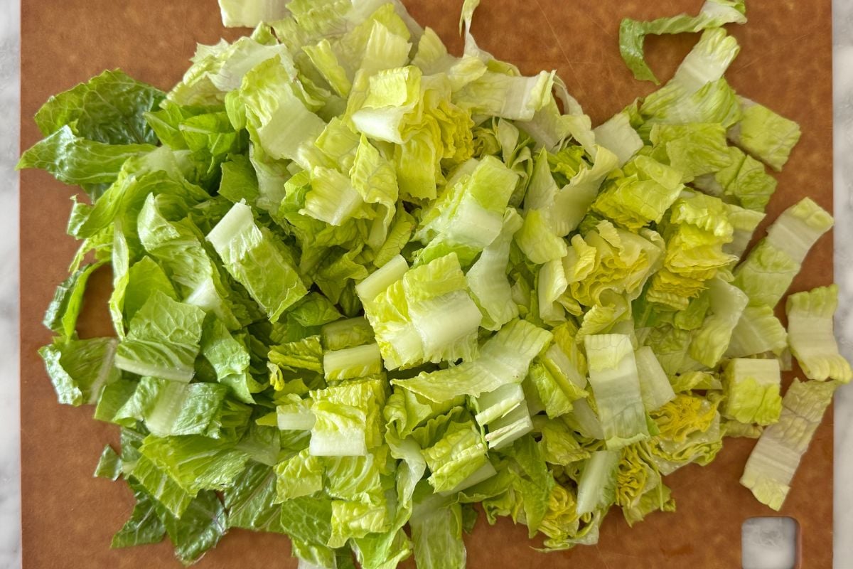 Chopped romaine hearts on a cutting board.