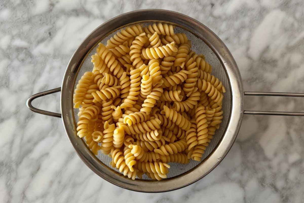 Cooked protein pasta in a strainer | Healthy Foodie Girl Cooked protein pasta in a strainer.