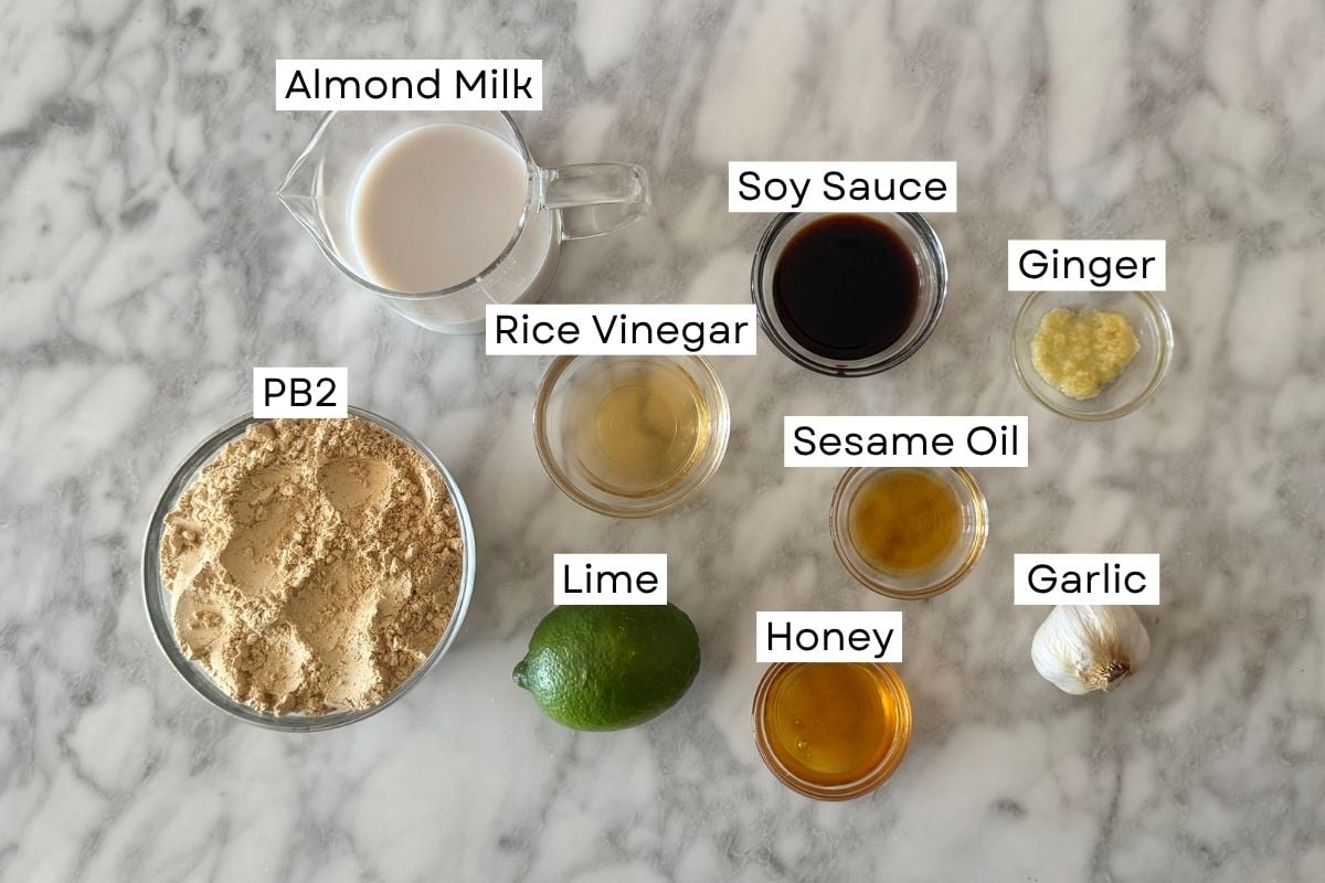 Ingredients for healthy Thai peanut dressing in bowls | Healthy Foodie Girl Ingredients for healthy Thai peanut dressing in bowls.