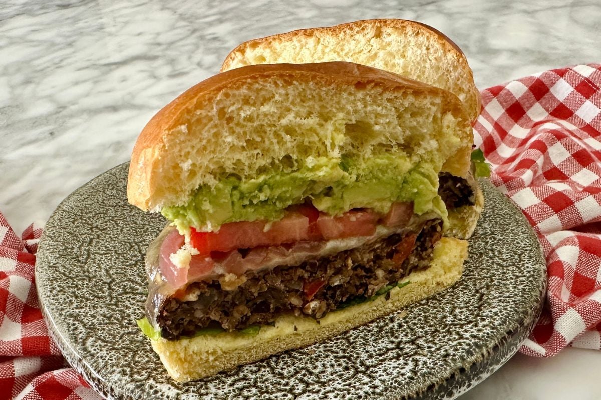 Sliced chipotle black bean burger on a plate.