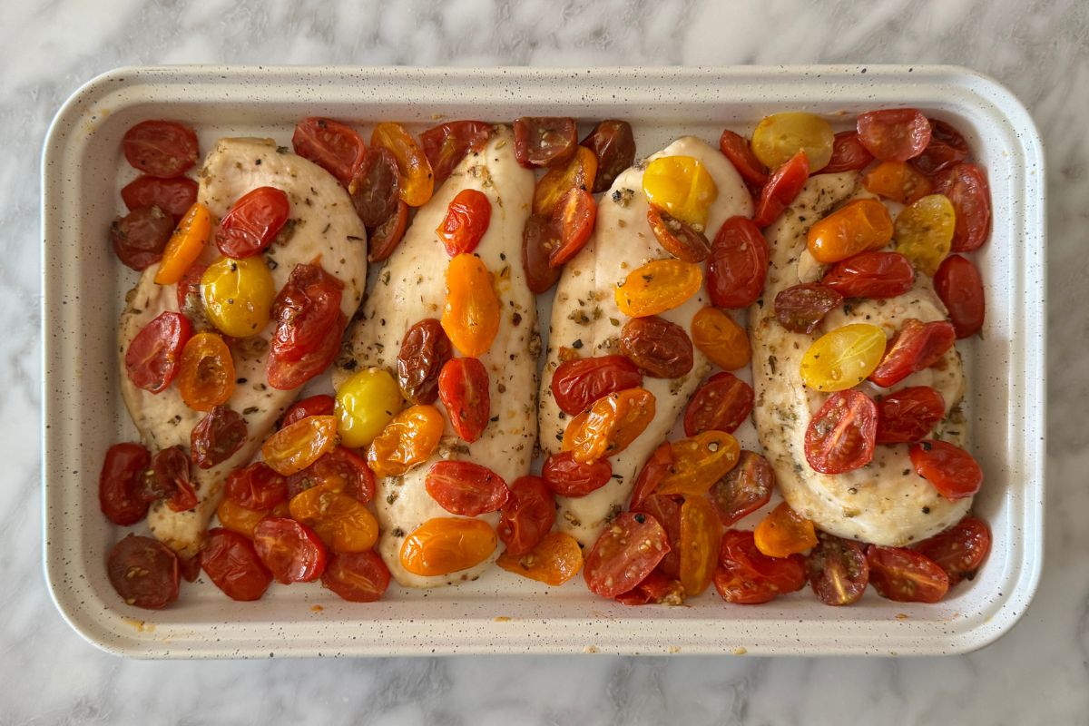 Baked chicken and roasted tomatoes on a sheet pan | Healthy Foodie Girl Baked chicken and roasted tomatoes on a sheet pan.
