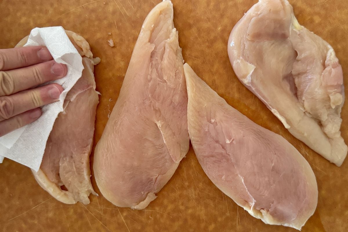 Chicken pat dry with paper towels | Healthy Foodie Girl Chicken pat dry with paper towels.
